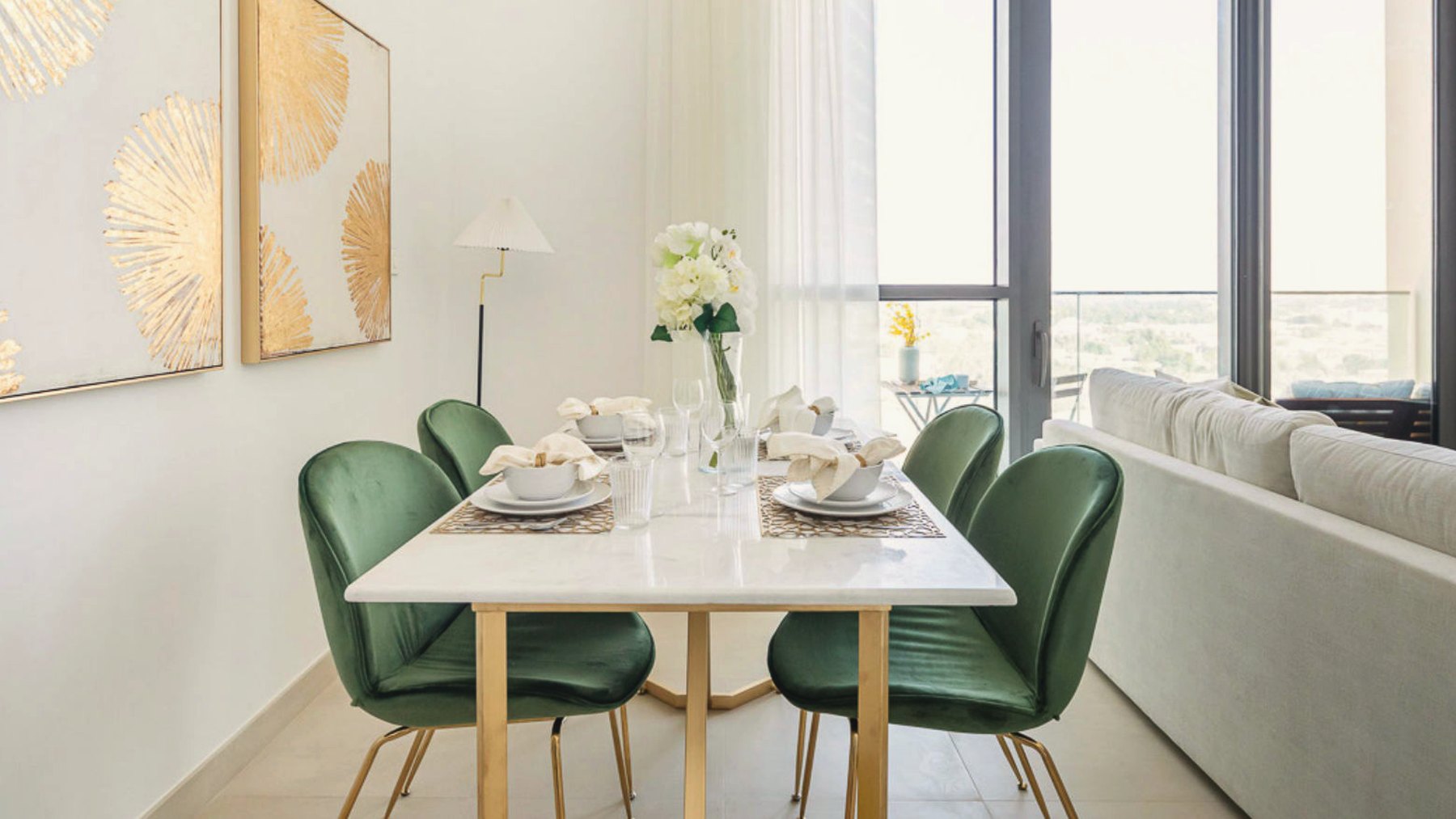 Dining table with green velvet chairs