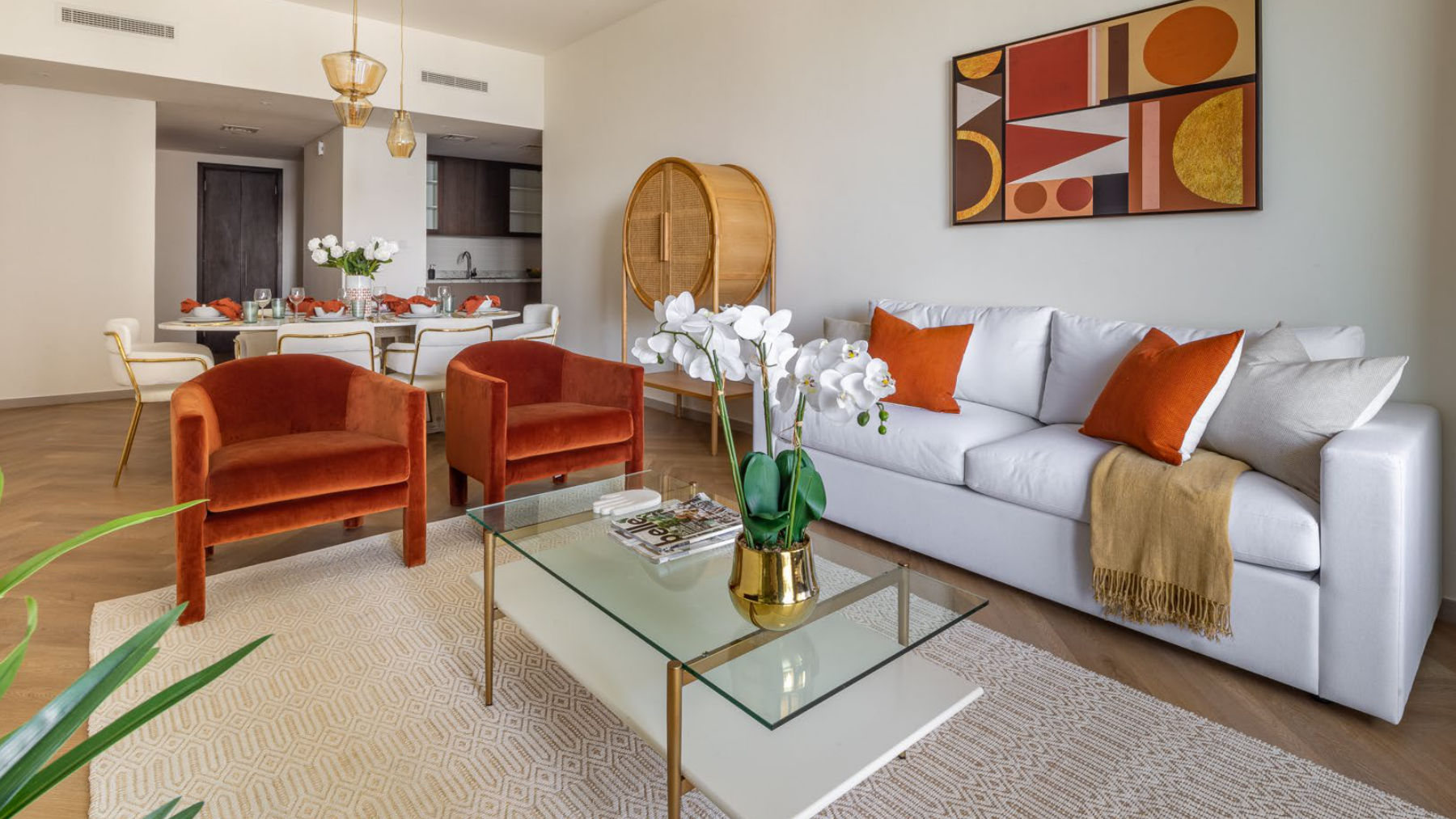 Living room with orange accent chairs
